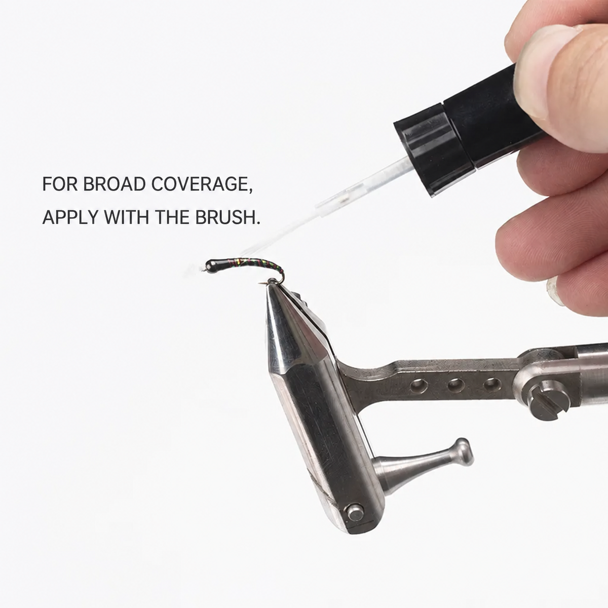 Applying UV resin with the brush for broad coverage