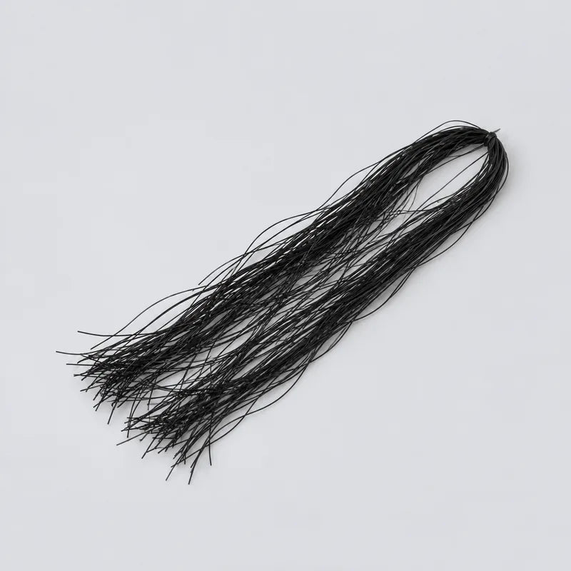 black Life Flex hank shown without packaging on a light gray surface