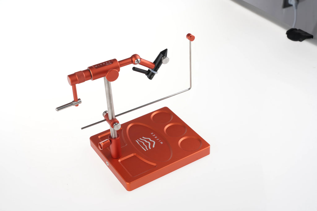 WIFREO Flow orange rotary fly tying vise, angled view