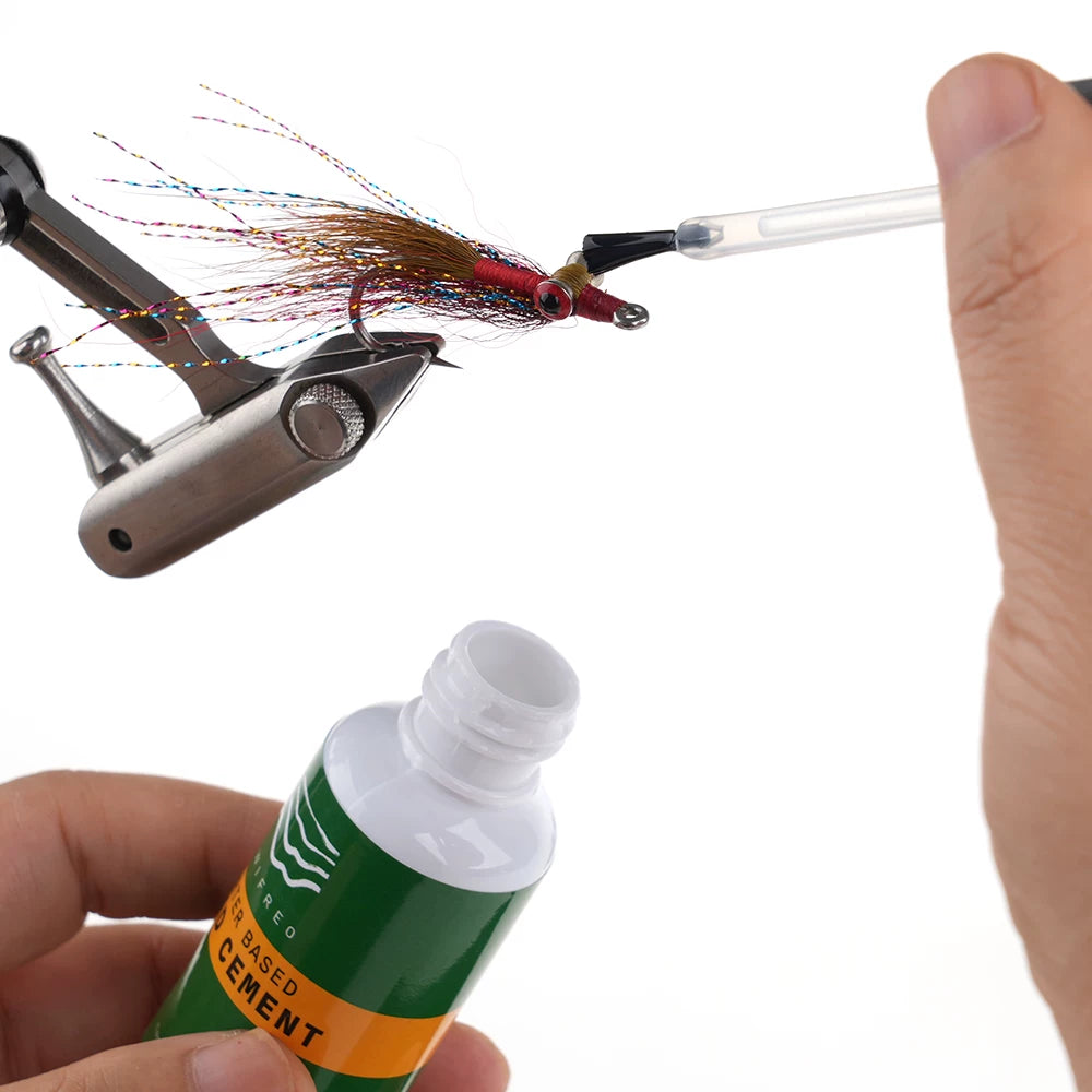 Applying head cement to a finished fly